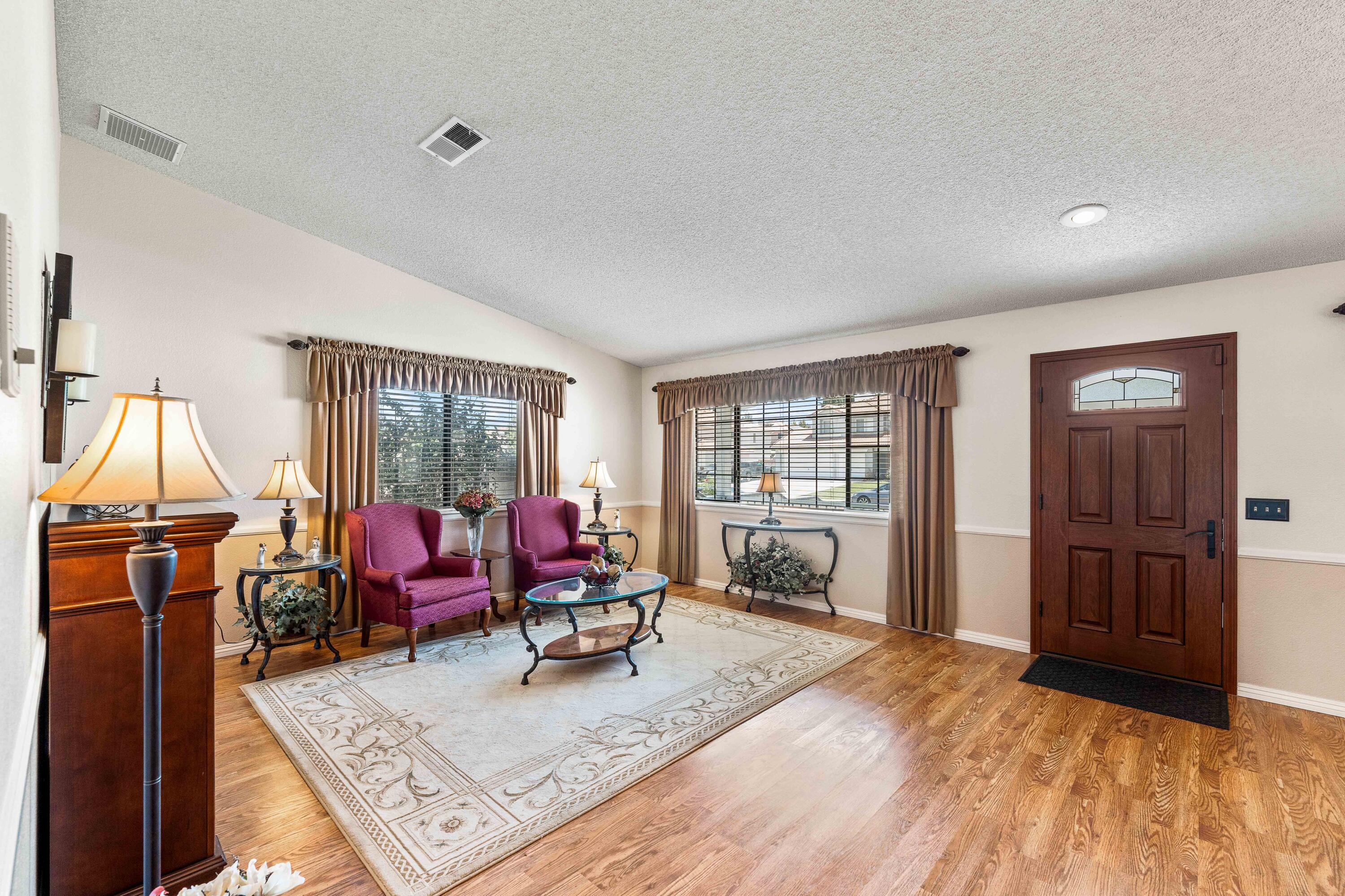 6311 West Ave L12 Lancaster, CA 93536 - Photo 9 of 55 a living room with furniture and a window