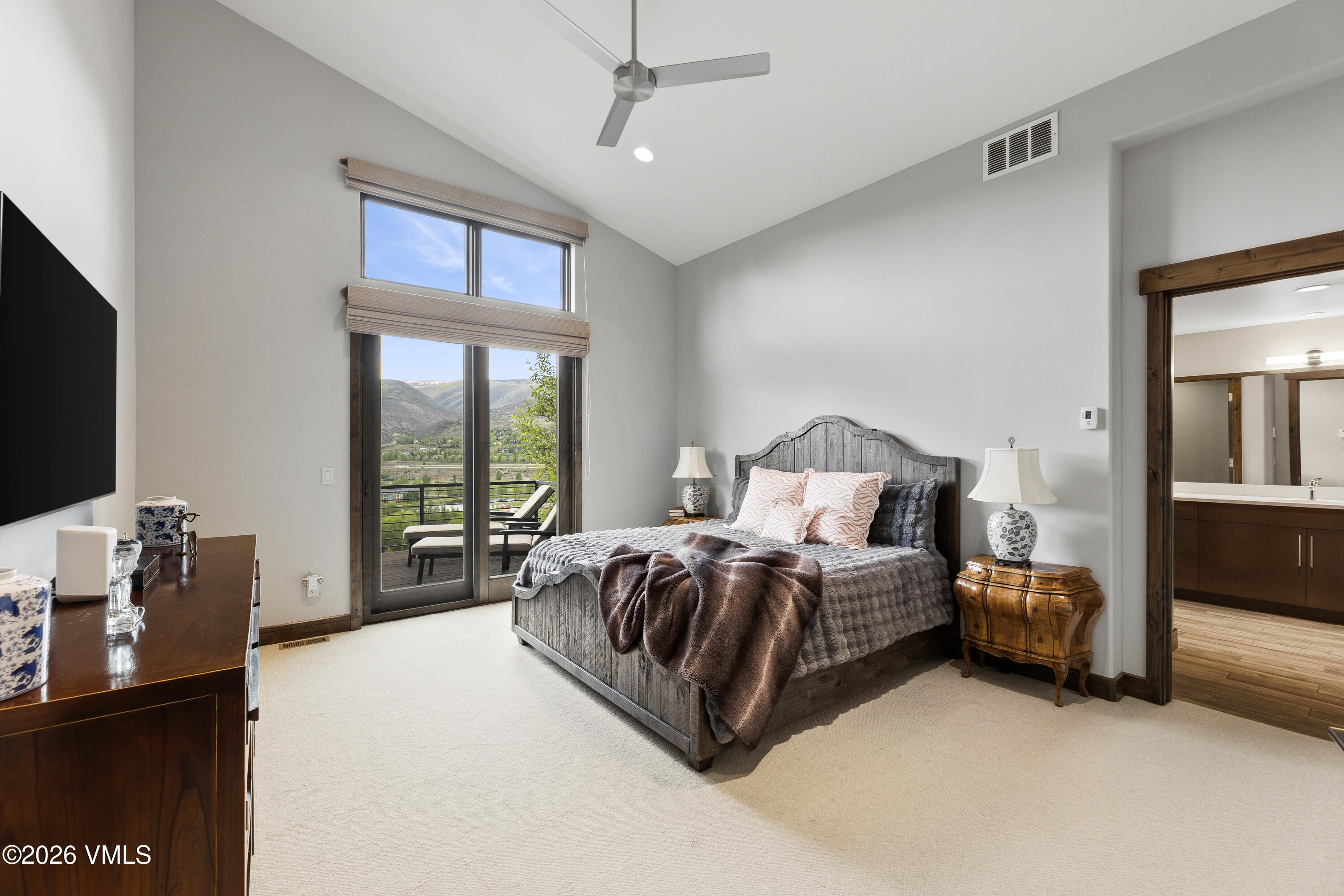 91 Edwards Pointe Edwards, CO 81632 - Photo 15 of 39 a spacious bedroom with a bed and large windows