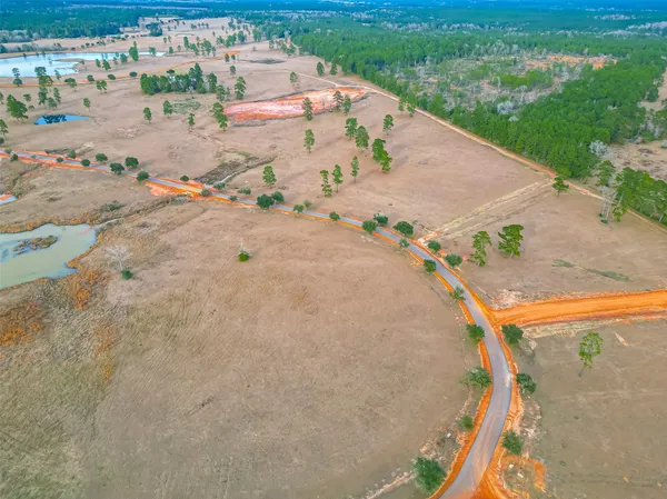 an aerial view of a house with a ocean view