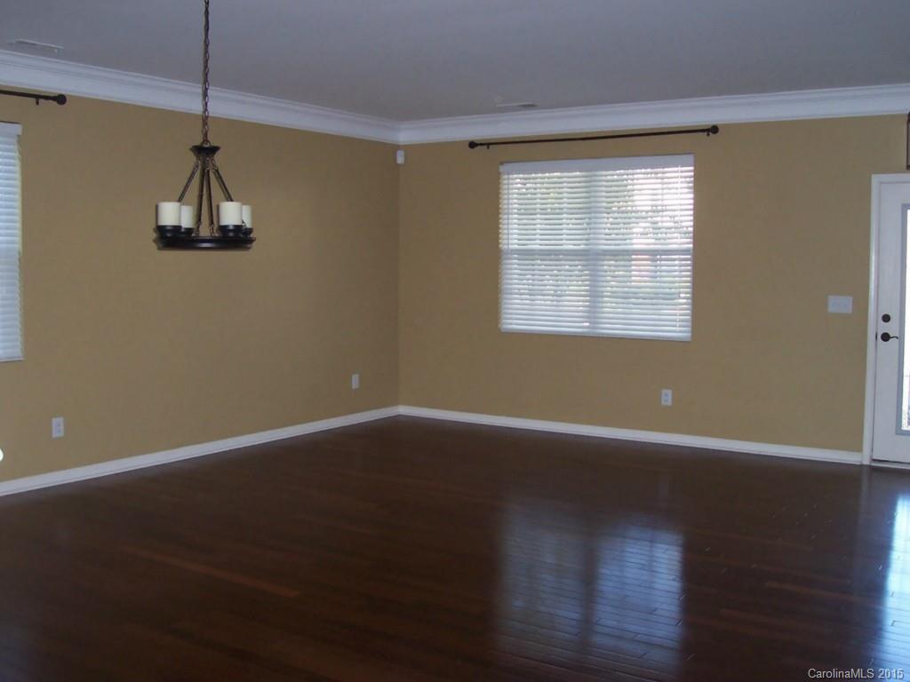1135 Spicewood Pines Road, Unit 15 Fort Mill, SC 29708 - Photo 3 of 15 a view of a room with wooden floor and windows