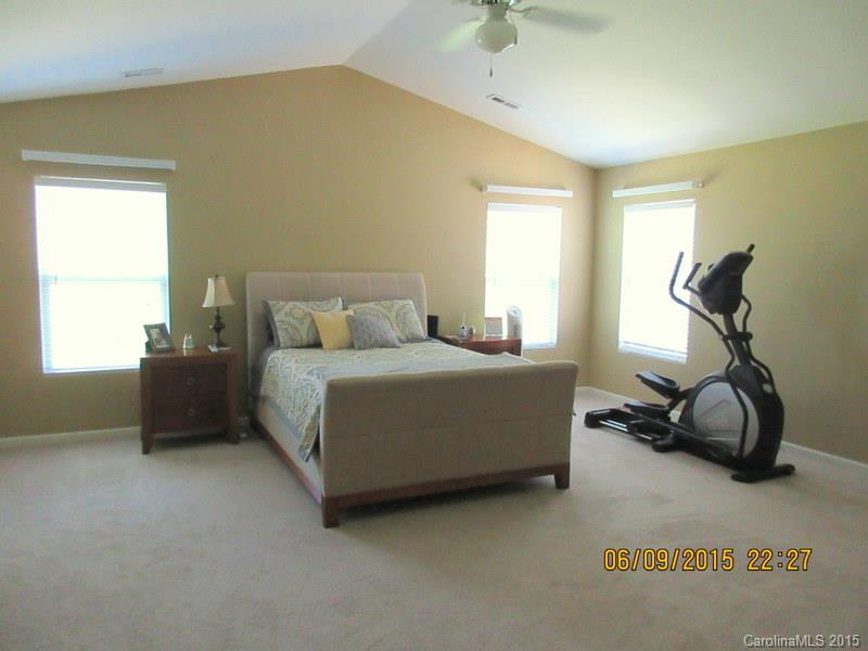 1135 Spicewood Pines Road, Unit 15 Fort Mill, SC 29708 - Photo 6 of 15 a bedroom with a bed and a window