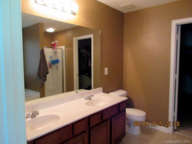 1135 Spicewood Pines Road, Unit 15 Fort Mill, SC 29708 - Photo 7 of 15 a bathroom with a sink and a mirror
