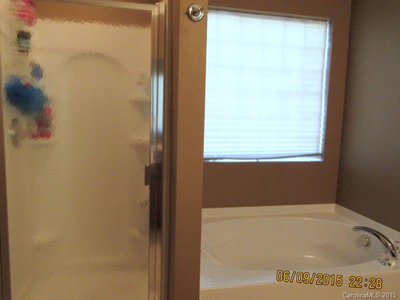1135 Spicewood Pines Road, Unit 15 Fort Mill, SC 29708 - Photo 8 of 15 a bathroom with a bathtub