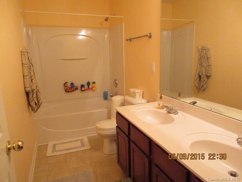 1135 Spicewood Pines Road, Unit 15 Fort Mill, SC 29708 - Photo 9 of 15 a bathroom with a sink a toilet and shower