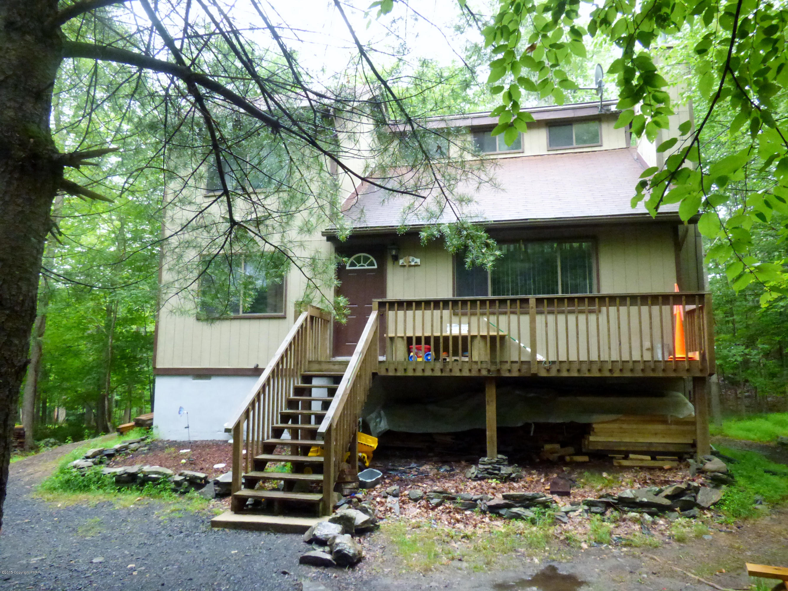 363 Canterbury Road Bushkill, PA 18324 - Photo 1 of 13 a view of a deck with a wooden deck