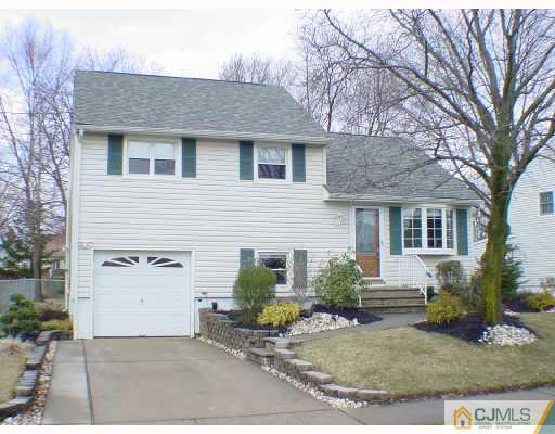 13 Leland Road Edison, NJ 08817 - Photo 1 of 10 a view of a white house with a yard and large tree