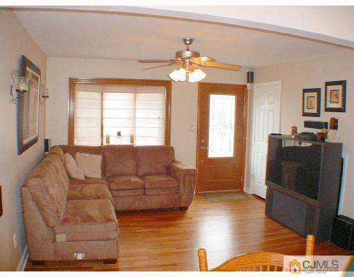 13 Leland Road Edison, NJ 08817 - Photo 2 of 10 a living room with furniture window and wooden floor