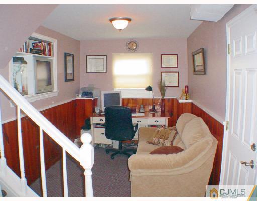 13 Leland Road Edison, NJ 08817 - Photo 5 of 10 a living room with furniture and a window