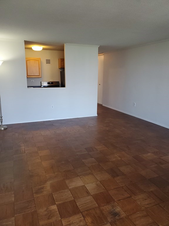 2 Hawthorne Place, Unit 7B Boston, MA 02114 - Photo 2 of 11 a view of a room with a tv and wooden floor