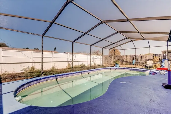 a view of a swimming pool with a patio