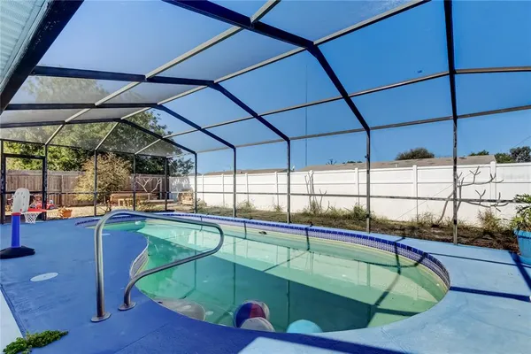 a view of a swimming pool with a lounge chairs