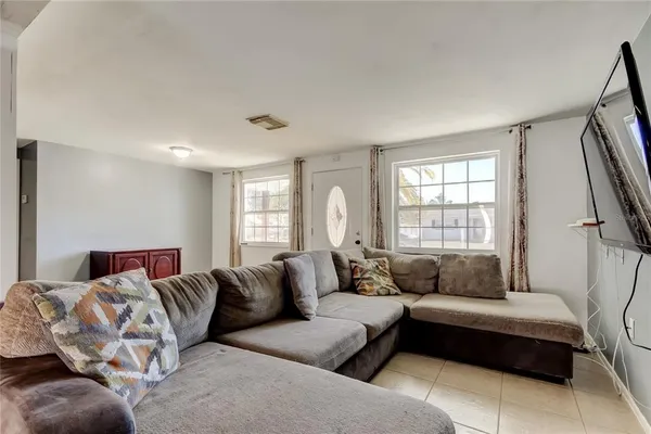 a living room with furniture and a window