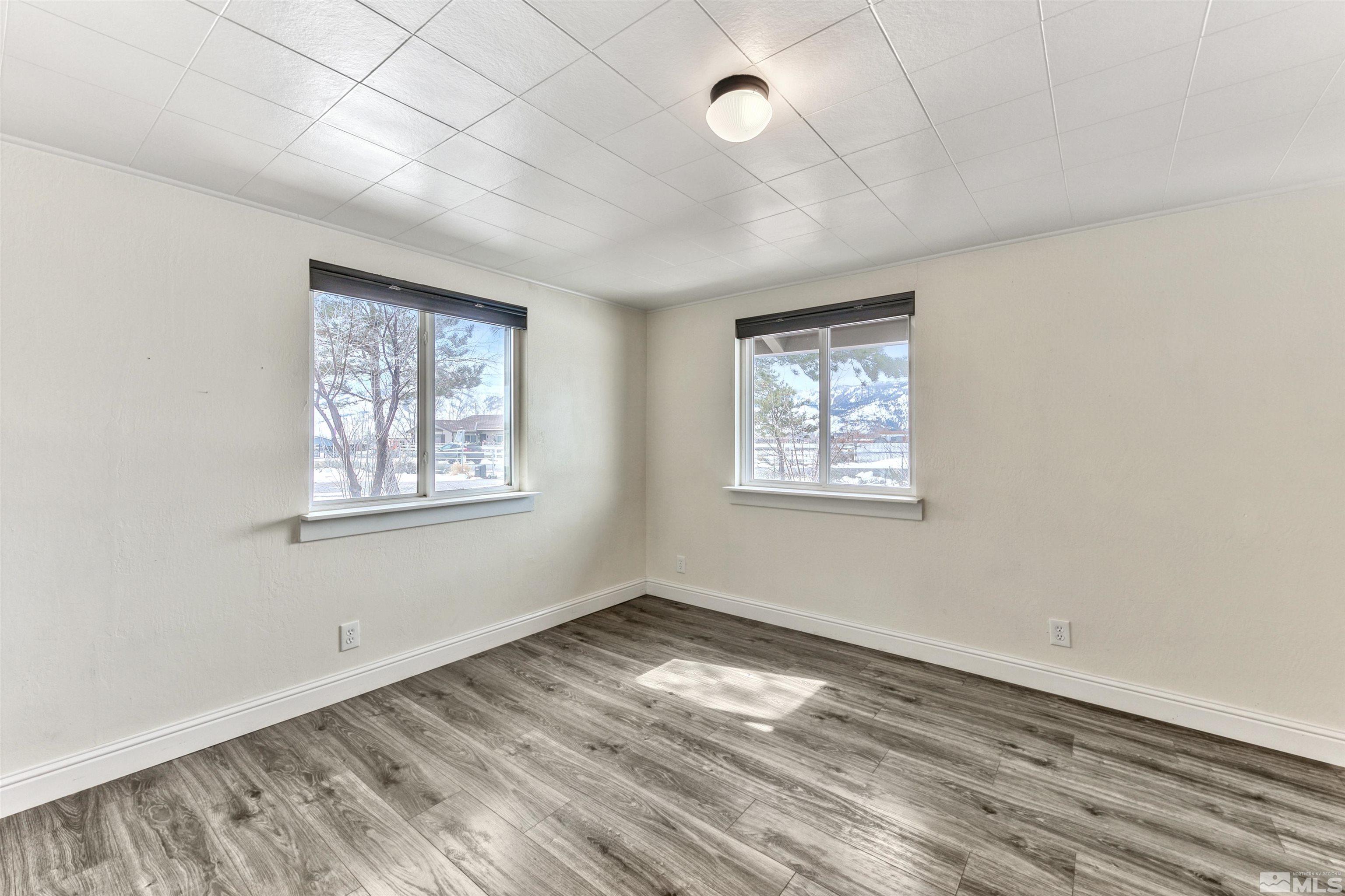 3900 Ormsby Place Washoe Valley, NV 89704 - Photo 13 of 18 a view of empty room with wooden floor and fan