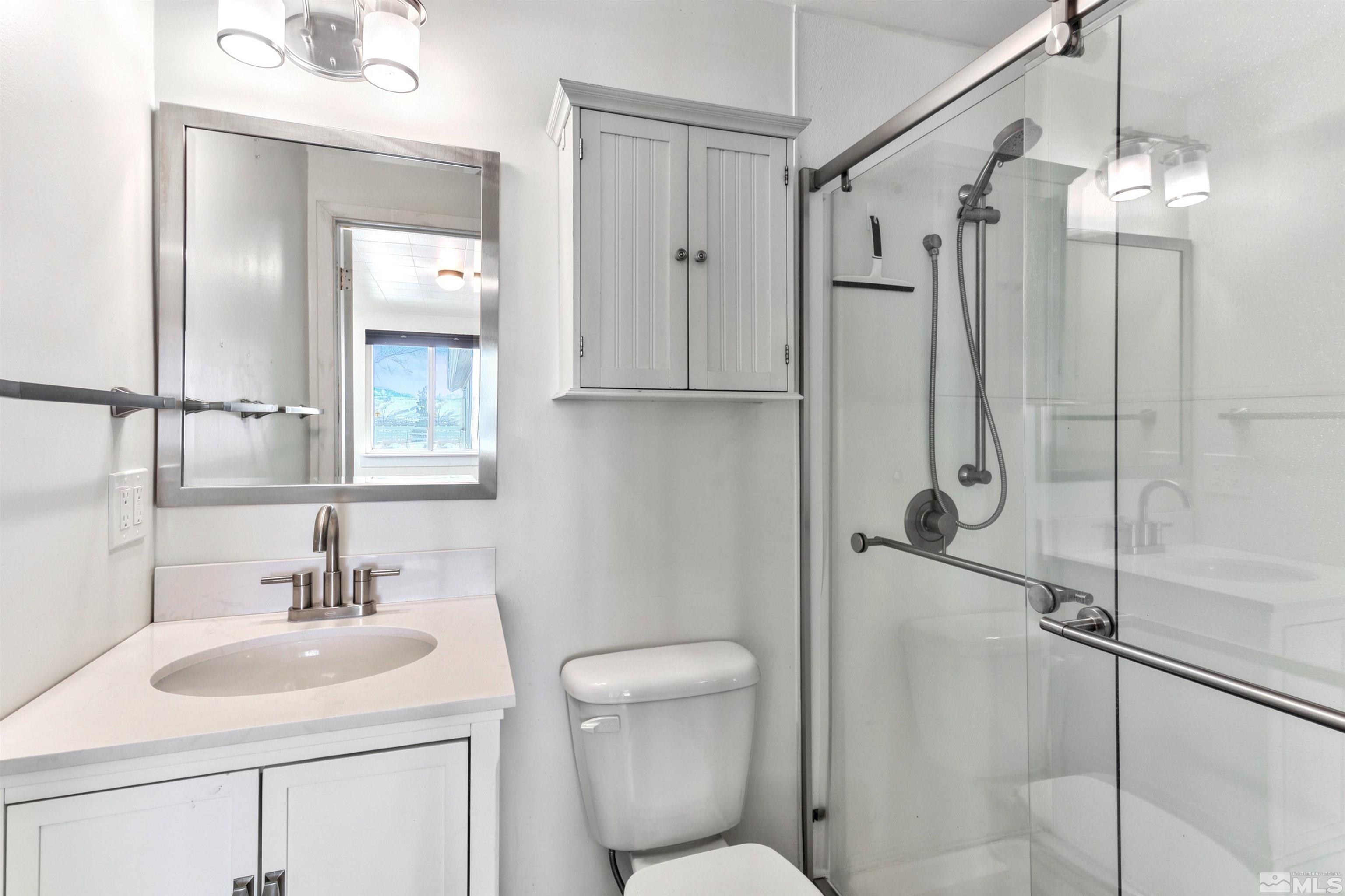 3900 Ormsby Place Washoe Valley, NV 89704 - Photo 14 of 18 a bathroom with a sink toilet and shower