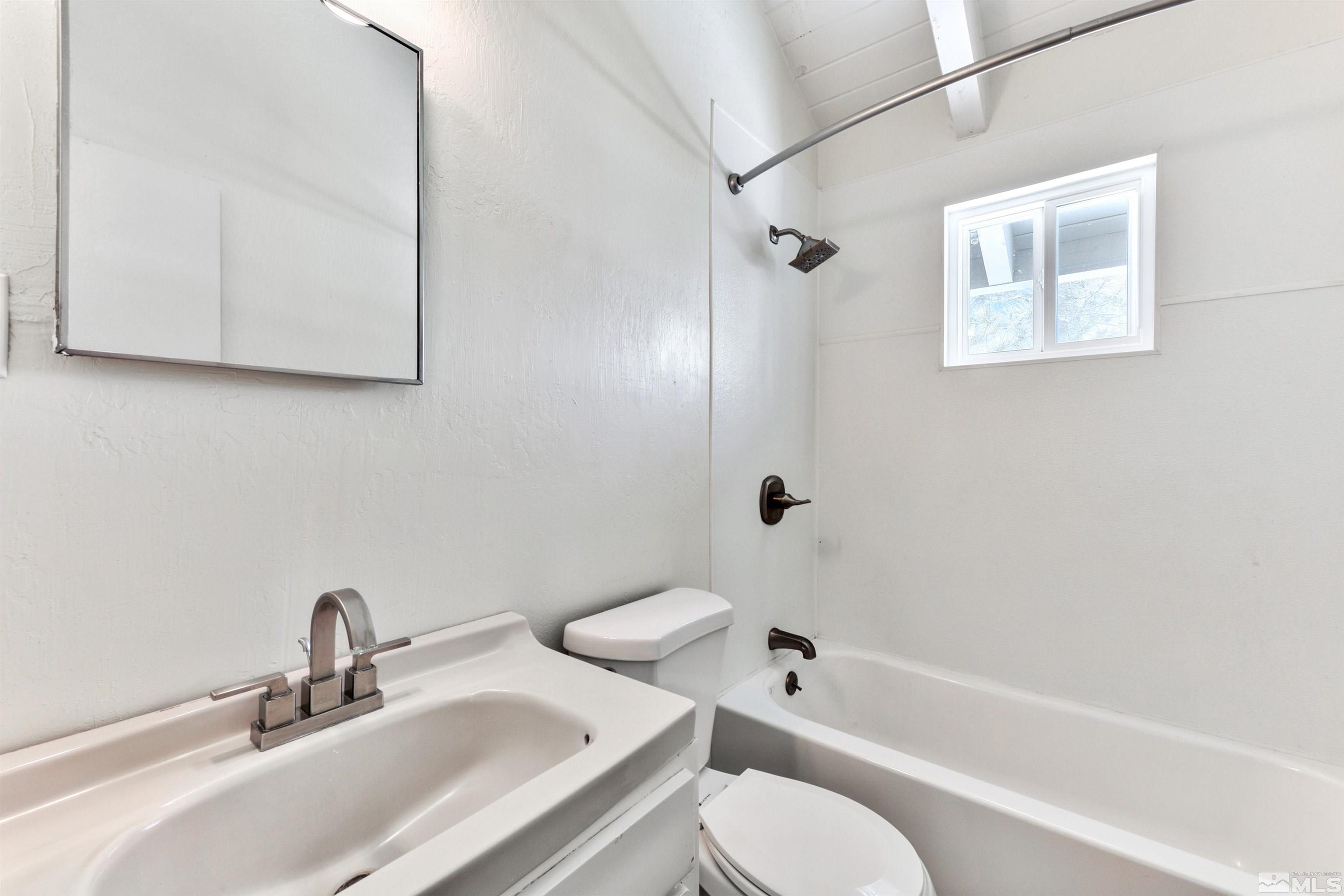 3900 Ormsby Place Washoe Valley, NV 89704 - Photo 17 of 18 a bathroom with a sink toilet and shower
