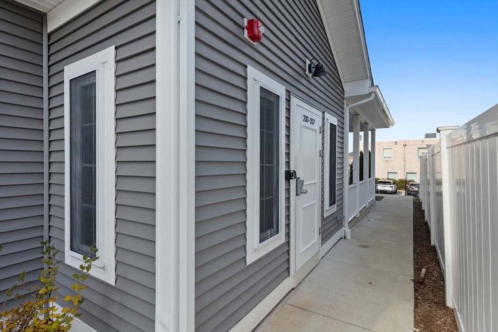 3 Burke Lane, Unit 203 Wellesley, MA 02481 - Photo 22 of 23 a view of a house with a outdoor space