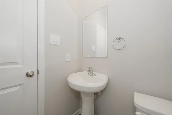 a bathroom with a sink toilet