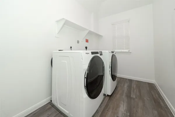 a spacious bathroom with a sink toilet and shower