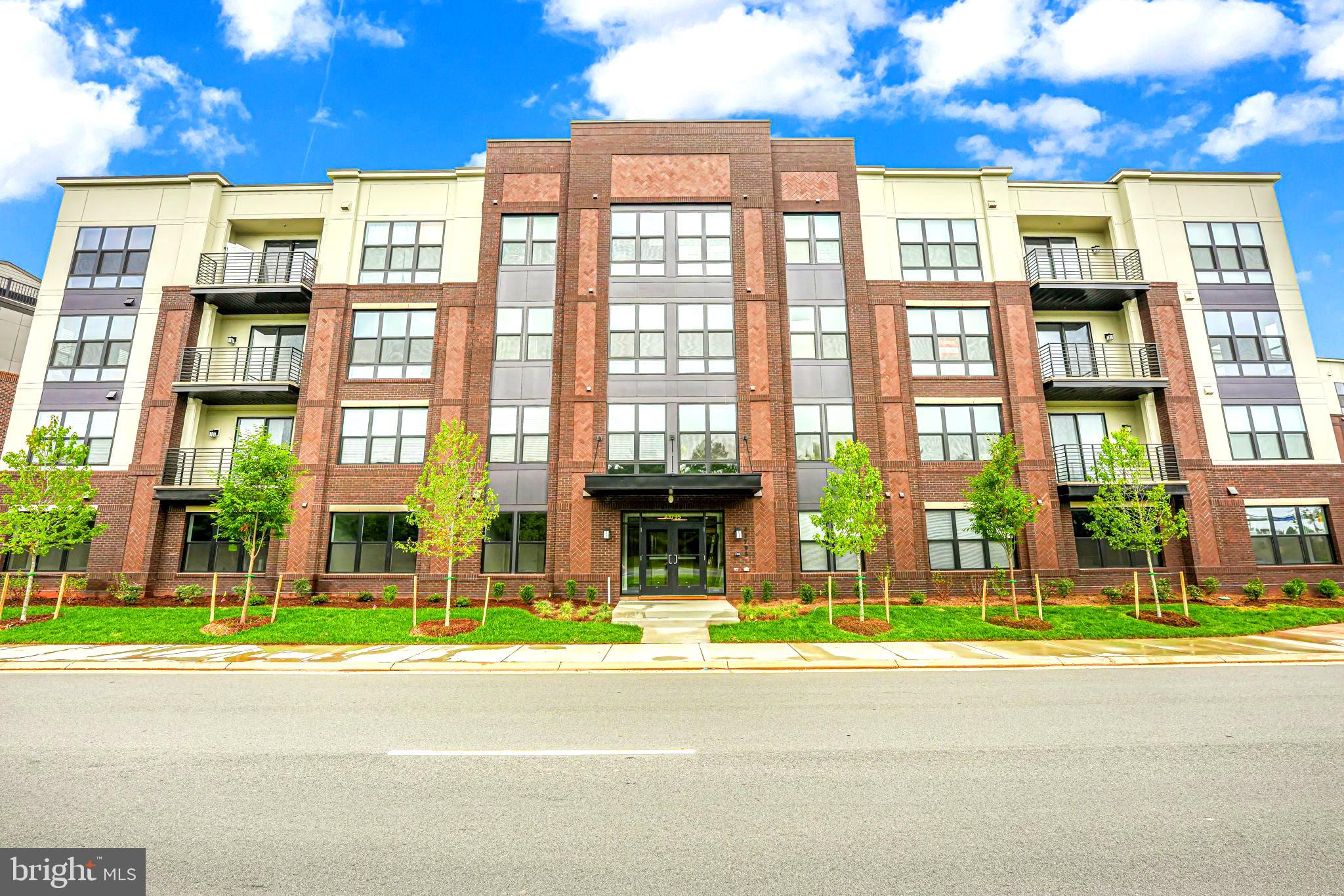 43795 Transit Square, Unit 101 Ashburn, VA 20147 - Photo 2 of 35 a view of a brick building with a street