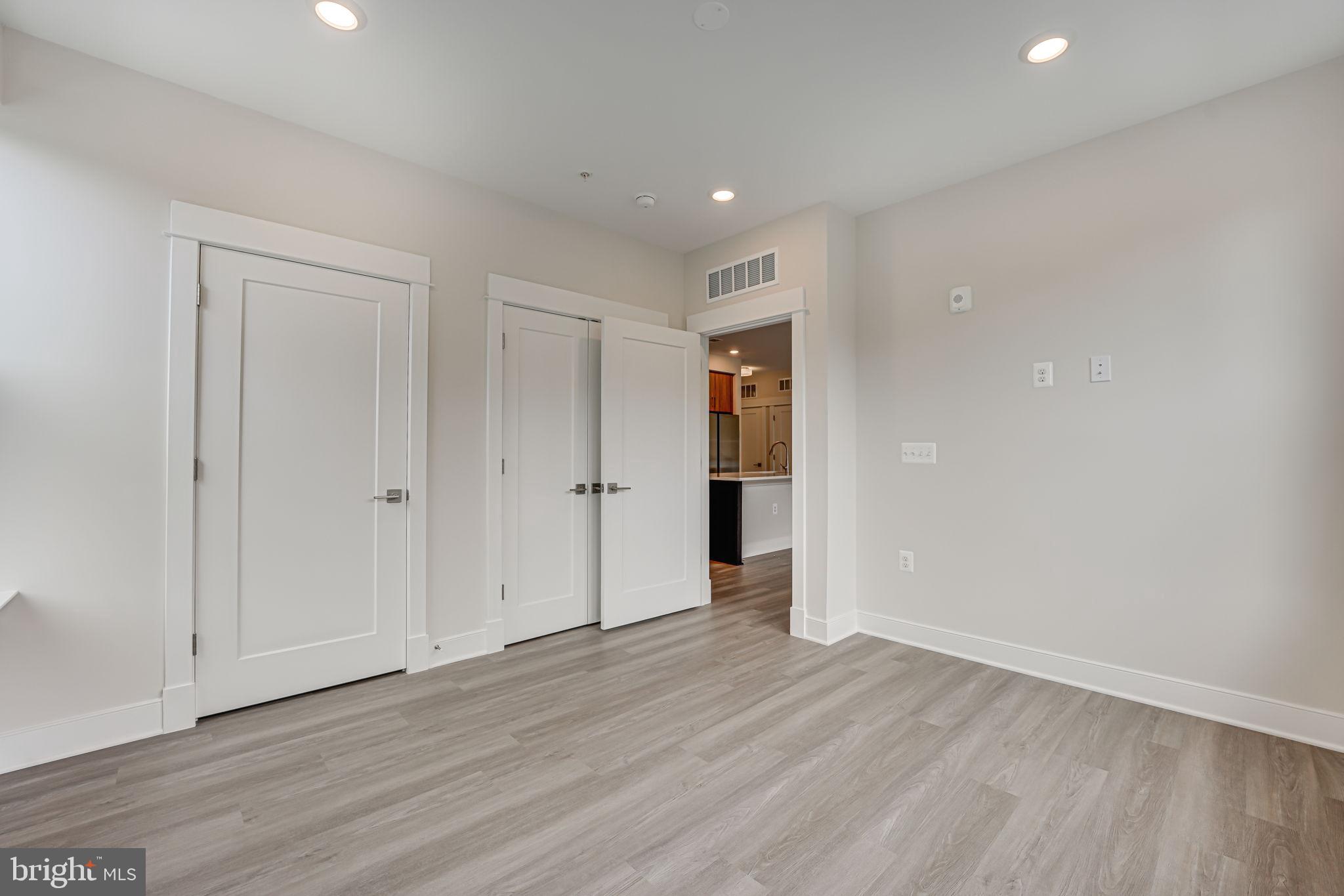 43795 Transit Square, Unit 101 Ashburn, VA 20147 - Photo 25 of 35 a view of empty room with wooden floor