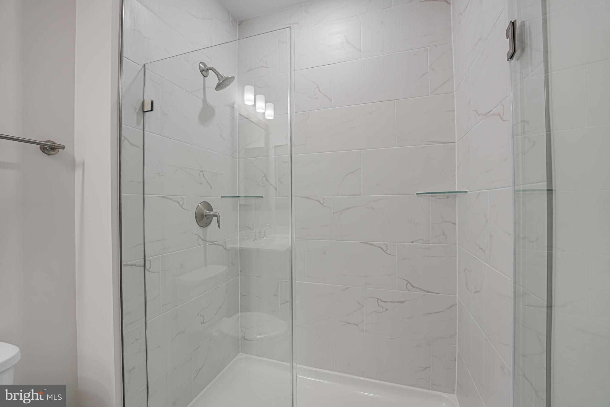 43795 Transit Square, Unit 101 Ashburn, VA 20147 - Photo 28 of 35 a bathroom with a shower