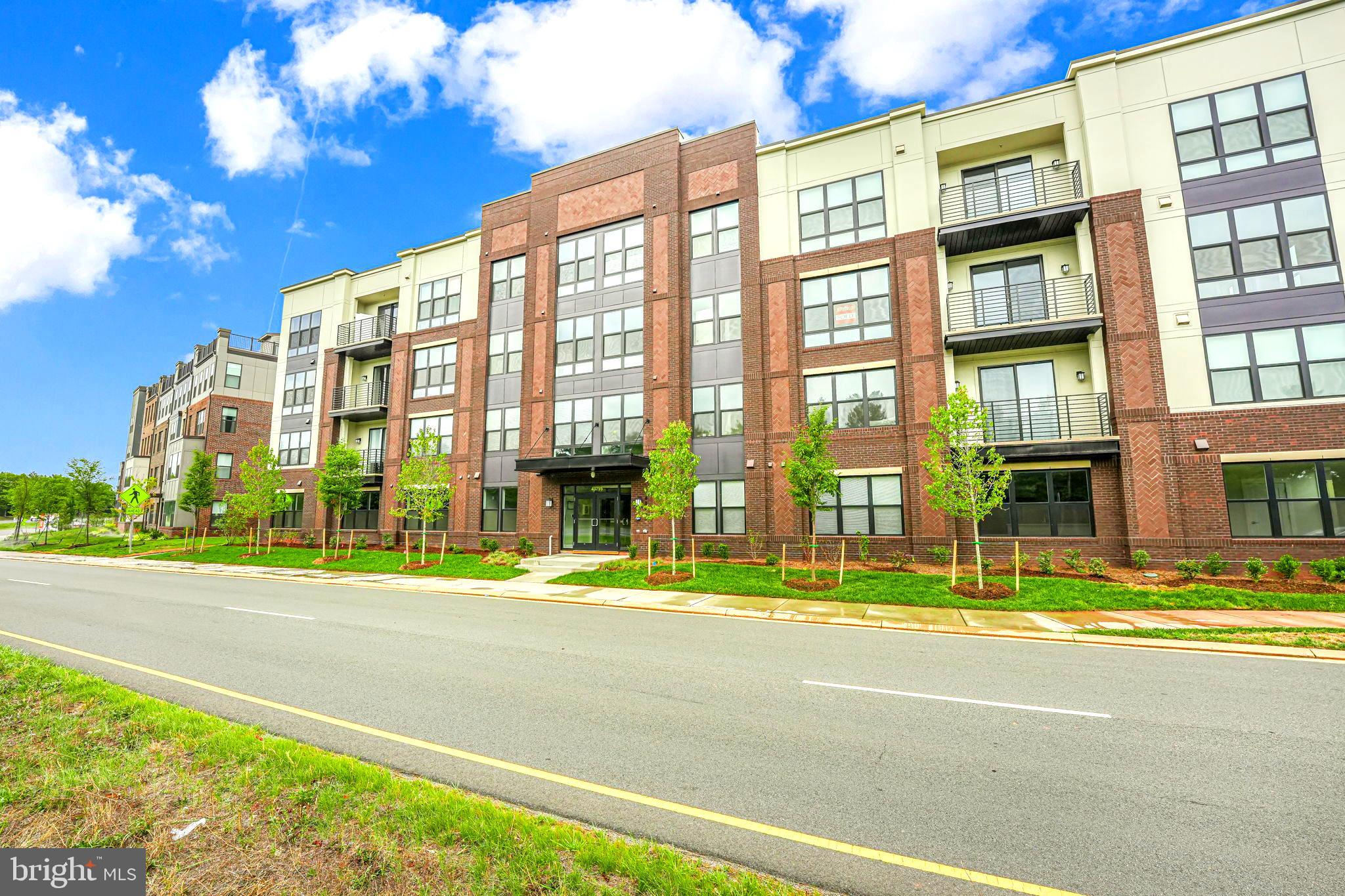 43795 Transit Square, Unit 101 Ashburn, VA 20147 - Photo 3 of 35 a view of a building with a street