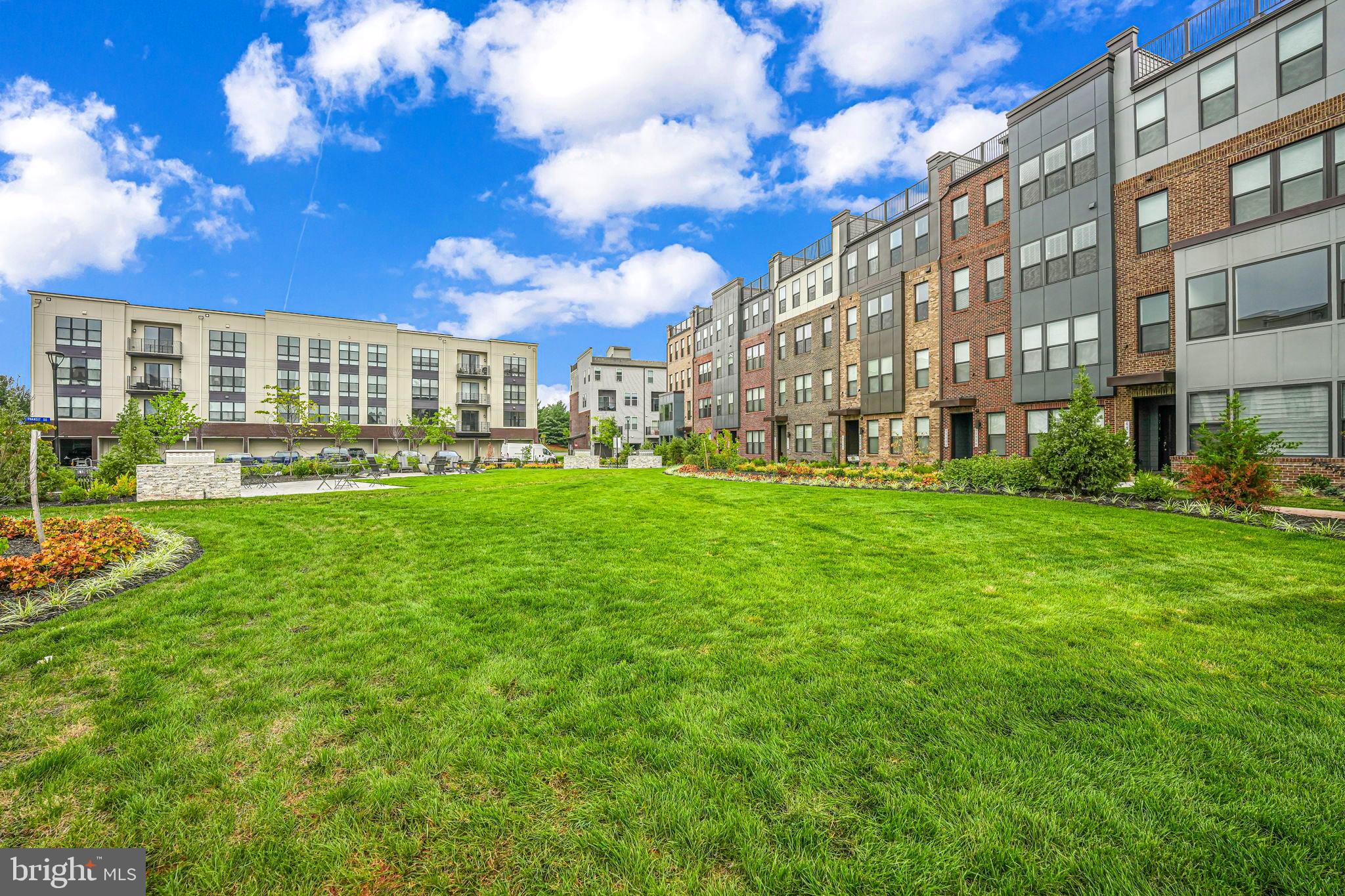 43795 Transit Square, Unit 101 Ashburn, VA 20147 - Photo 35 of 35 a view of a building with a yard