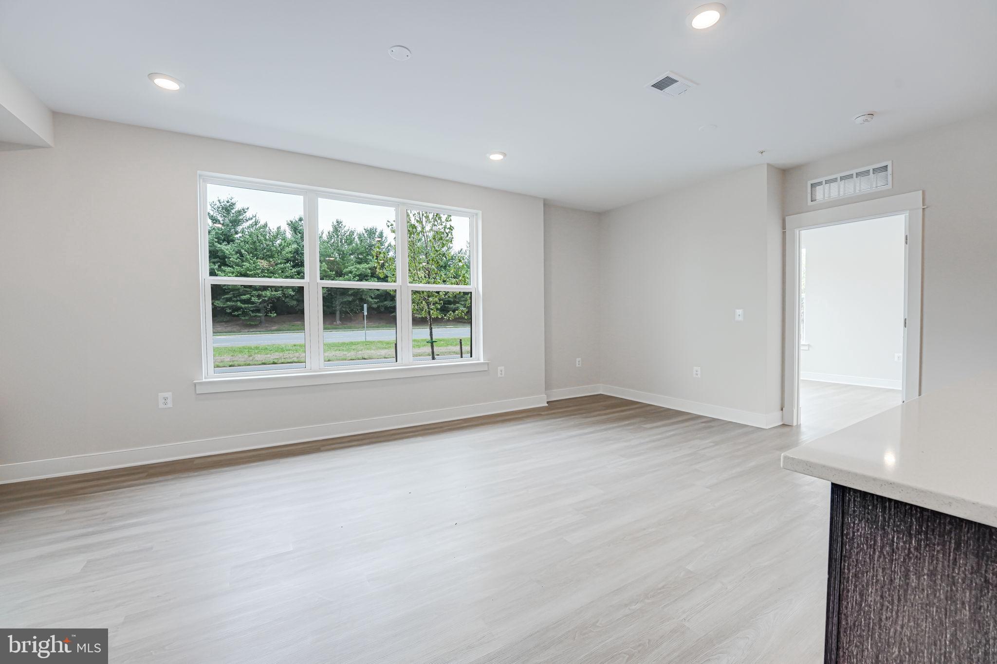 43795 Transit Square, Unit 101 Ashburn, VA 20147 - Photo 9 of 35 a view of an empty room with a window