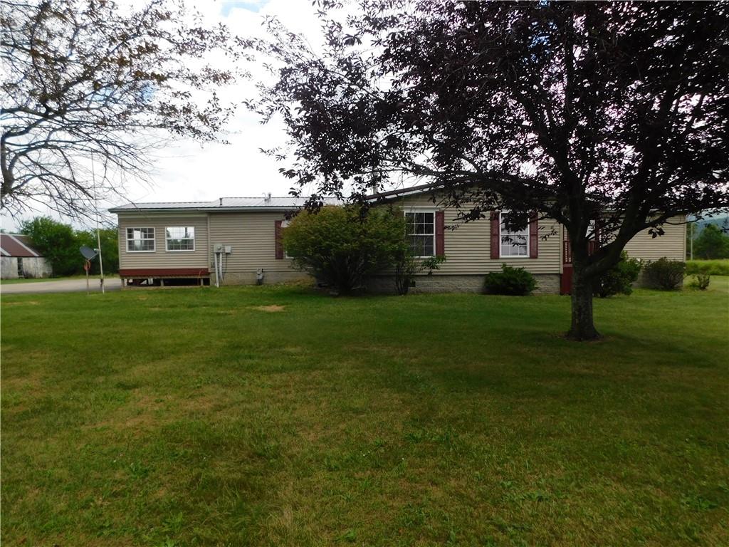 140 Firestone Road Smithfield, PA 15478 - Photo 1 of 33 a house view with a garden space