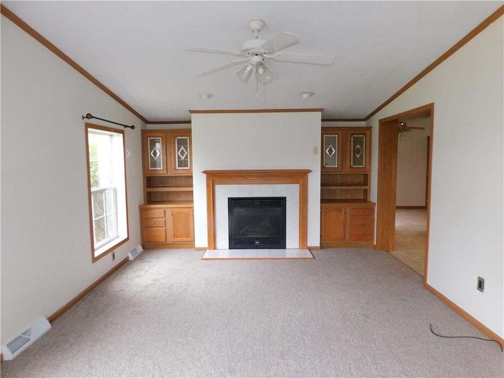140 Firestone Road Smithfield, PA 15478 - Photo 15 of 33 a view of an empty room with a fireplace and a window