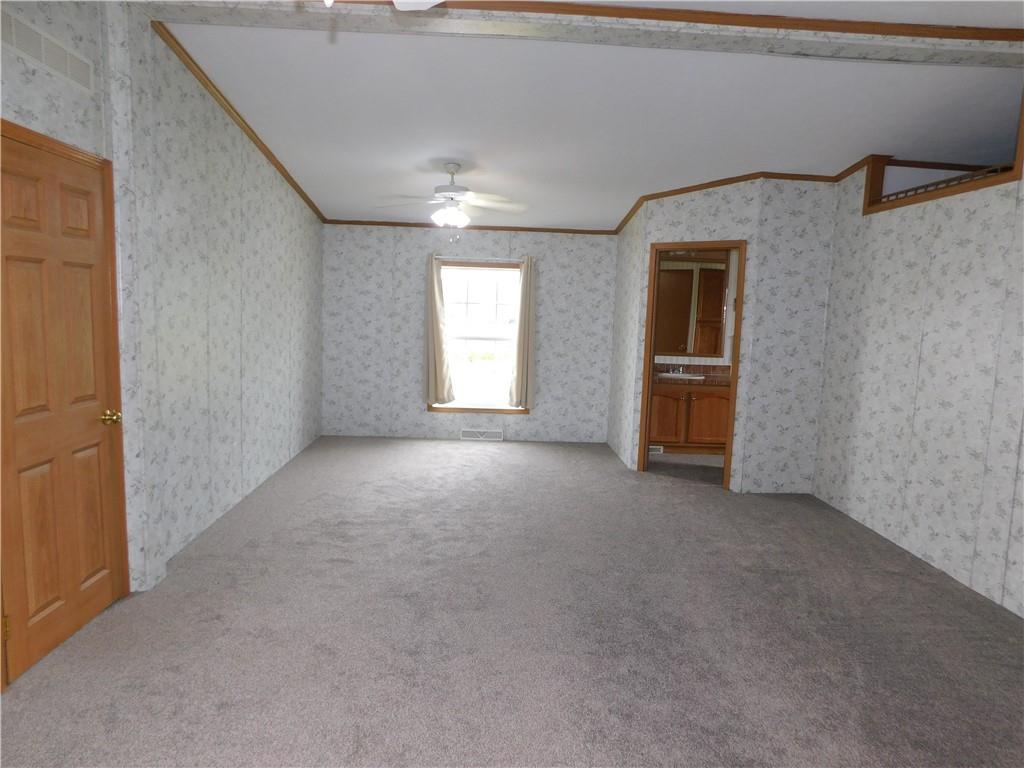 140 Firestone Road Smithfield, PA 15478 - Photo 22 of 33 an empty room with windows