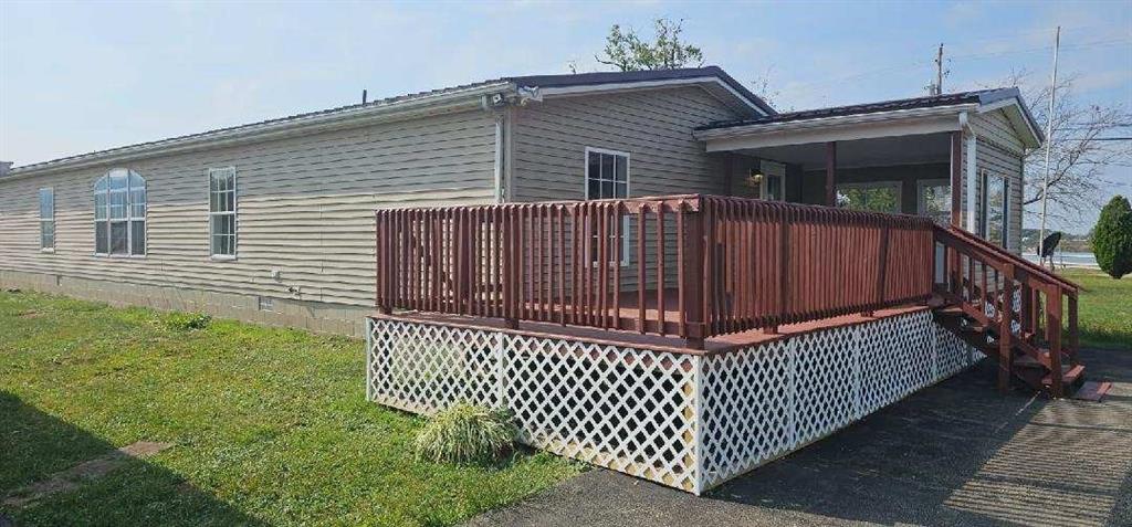 140 Firestone Road Smithfield, PA 15478 - Photo 3 of 33 a view of a brick house with wooden fence
