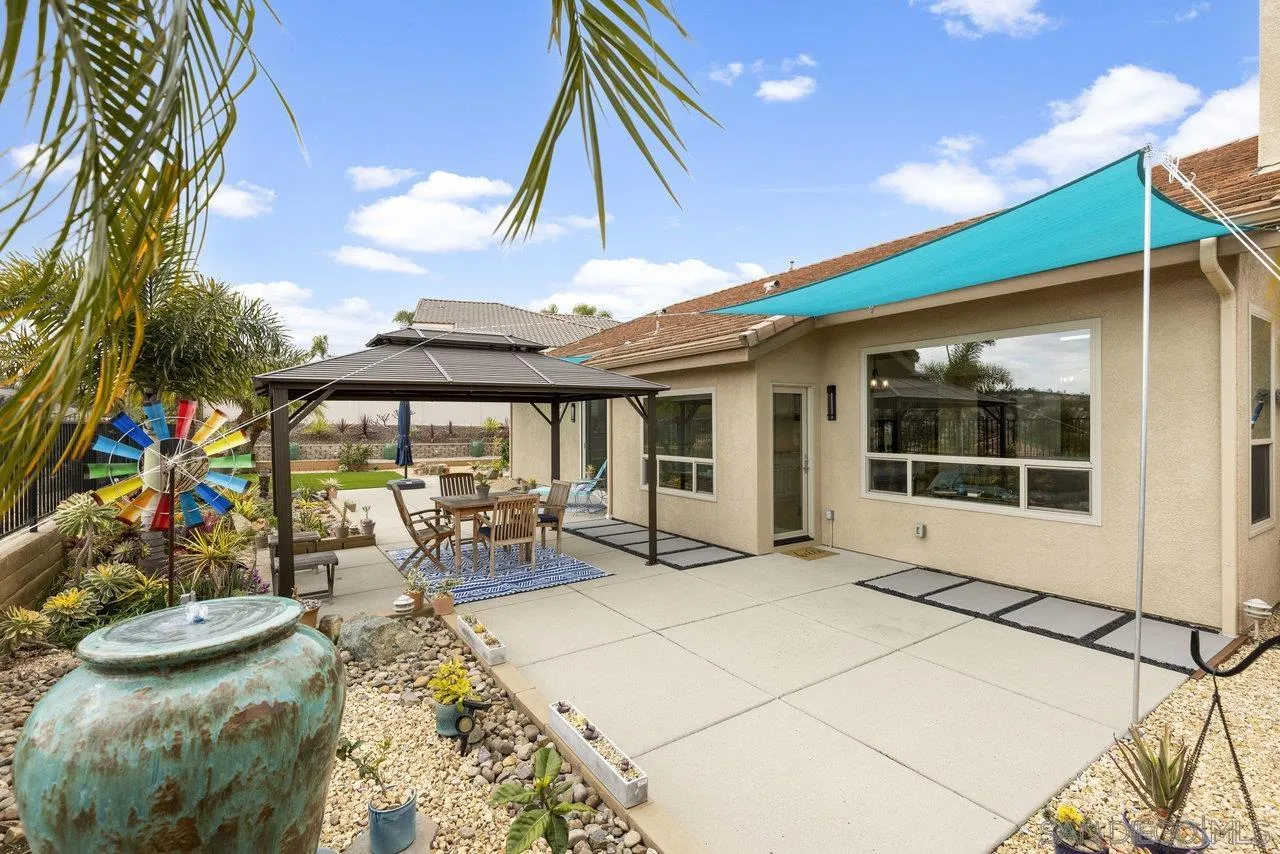 5167 Avenida De La Plata Oceanside, CA 92057 - Photo 12 of 53 a view of a patio with table and chairs and potted plants