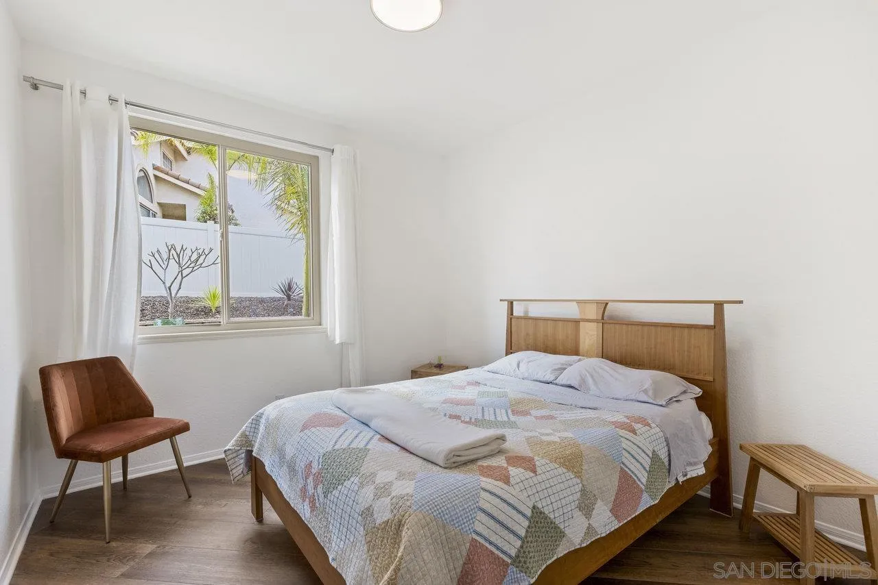 5167 Avenida De La Plata Oceanside, CA 92057 - Photo 23 of 53 a bedroom with a bed and a chair