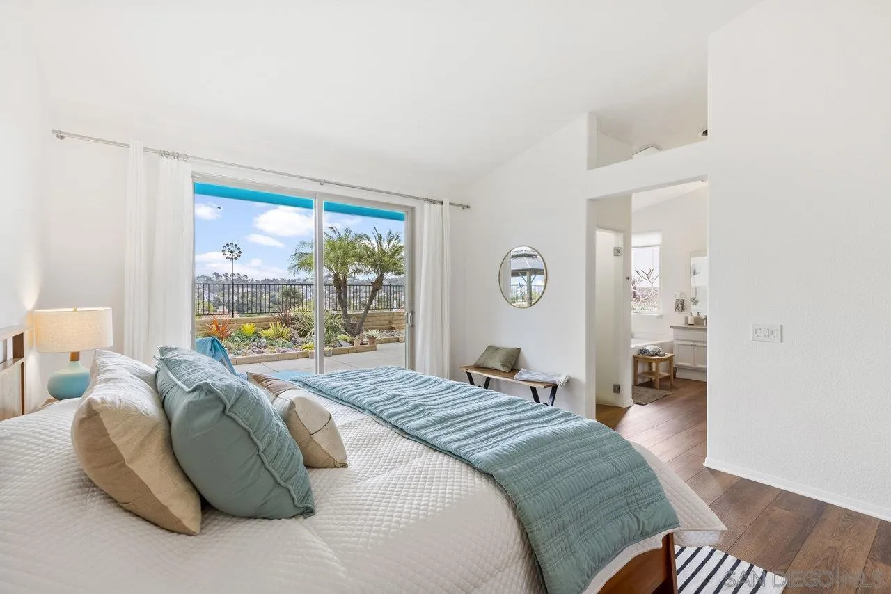 5167 Avenida De La Plata Oceanside, CA 92057 - Photo 24 of 53 a bedroom with a bed and a large window