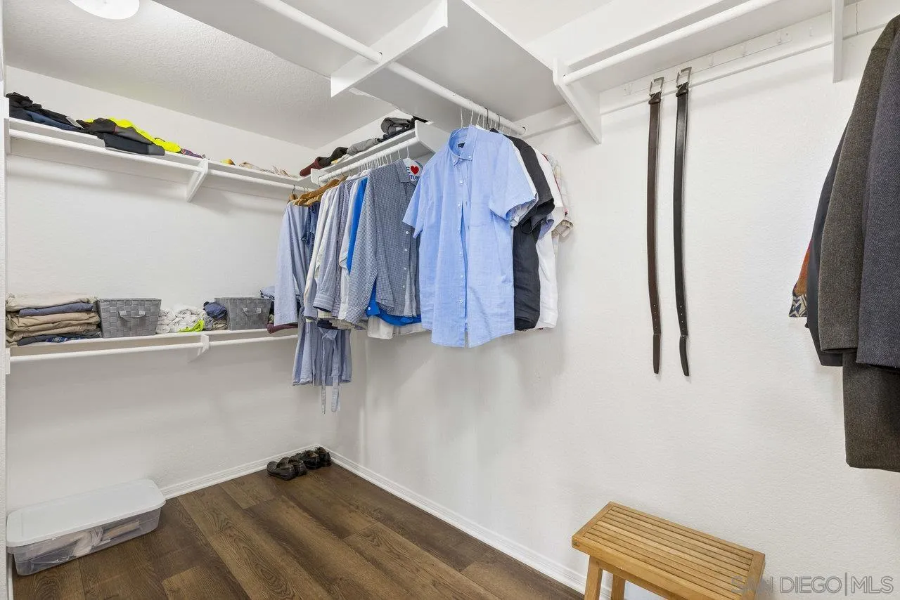 5167 Avenida De La Plata Oceanside, CA 92057 - Photo 26 of 53 a view of walk in closet with clothes and shoes