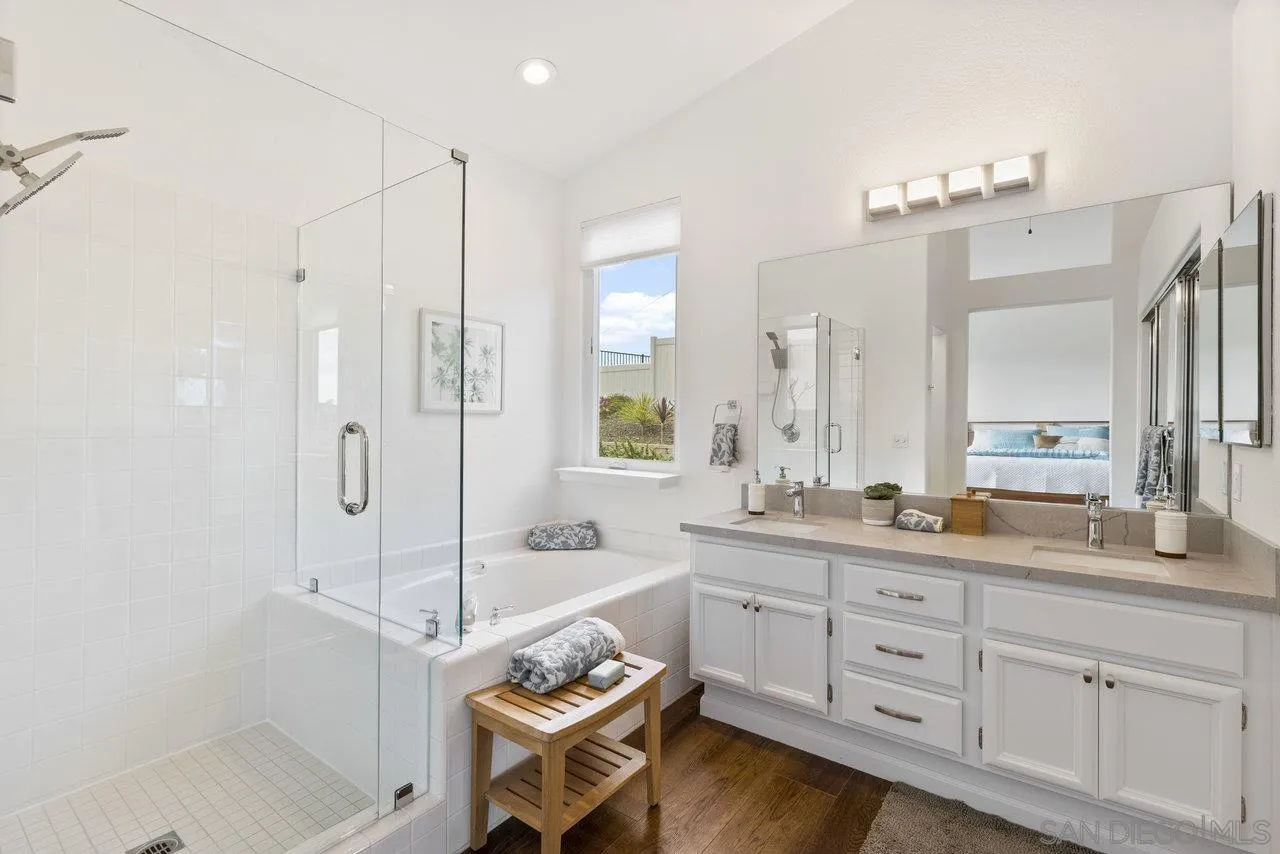 5167 Avenida De La Plata Oceanside, CA 92057 - Photo 29 of 53 a bathroom with a double vanity sink mirror double and shower