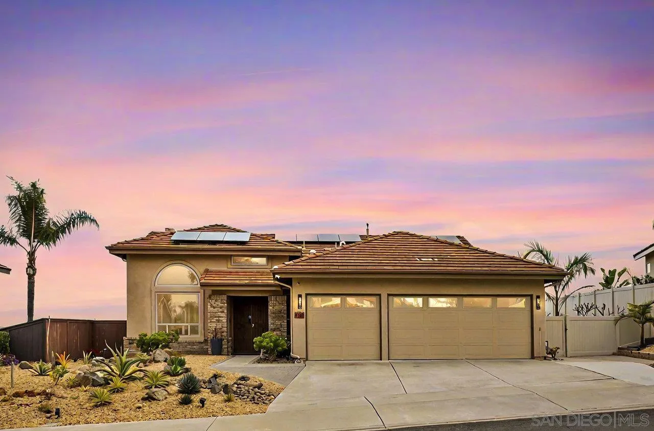 5167 Avenida De La Plata Oceanside, CA 92057 - Photo 3 of 53 a front view of a house with a garden