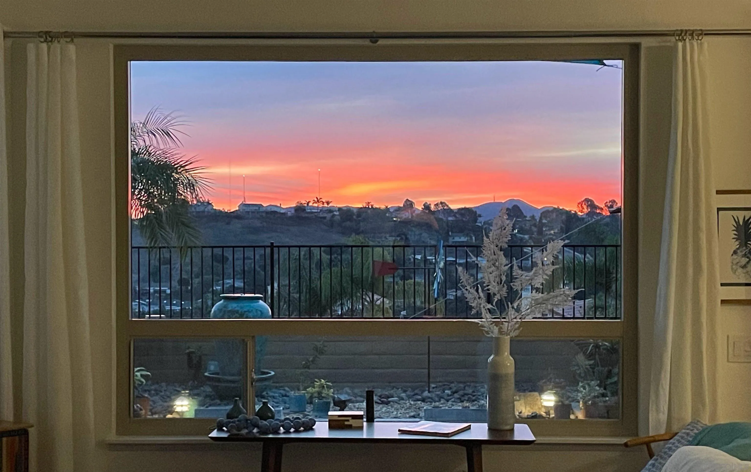 5167 Avenida De La Plata Oceanside, CA 92057 - Photo 38 of 53 a view of balcony with a couple of cars parked in front of it