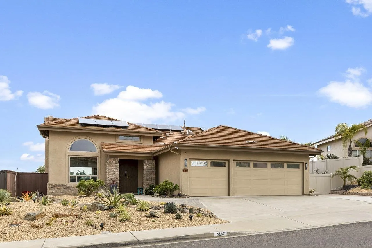 5167 Avenida De La Plata Oceanside, CA 92057 - Photo 4 of 53 a front view of a house with yard