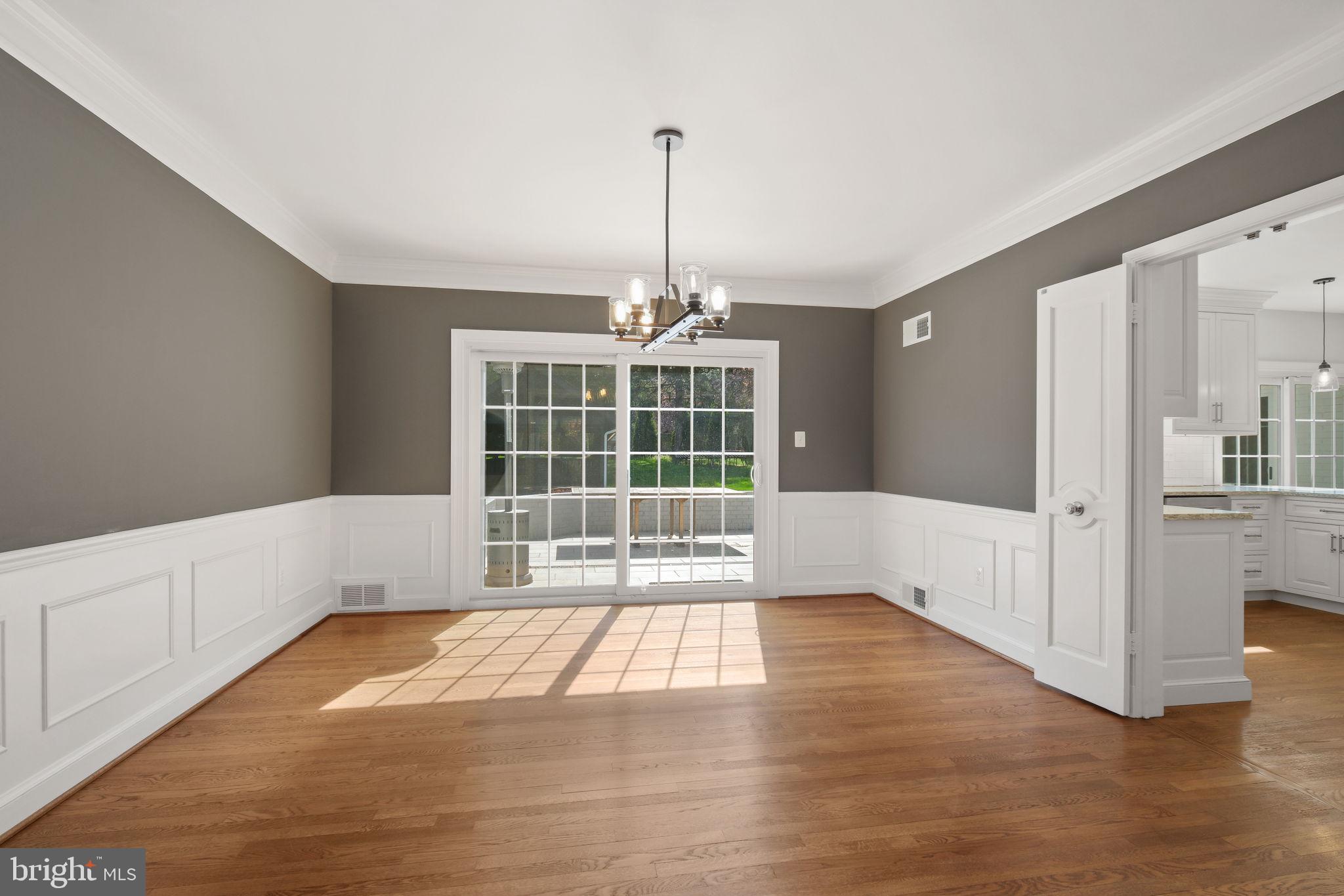 11005 Luxmanor Road North Bethesda, MD 20852 - Photo 12 of 49 a view of an empty room with wooden floor and a window