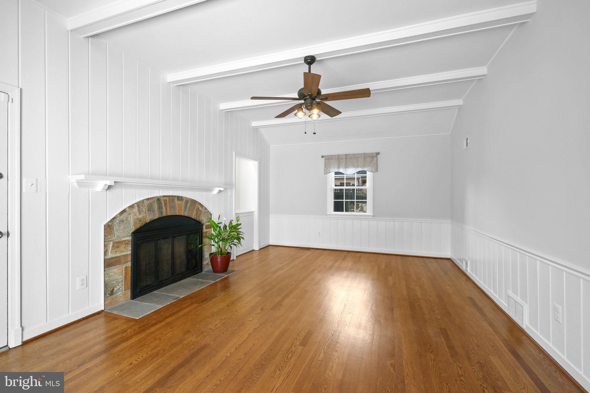 11005 Luxmanor Road North Bethesda, MD 20852 - Photo 15 of 49 a view of empty room with fireplace and wooden floor