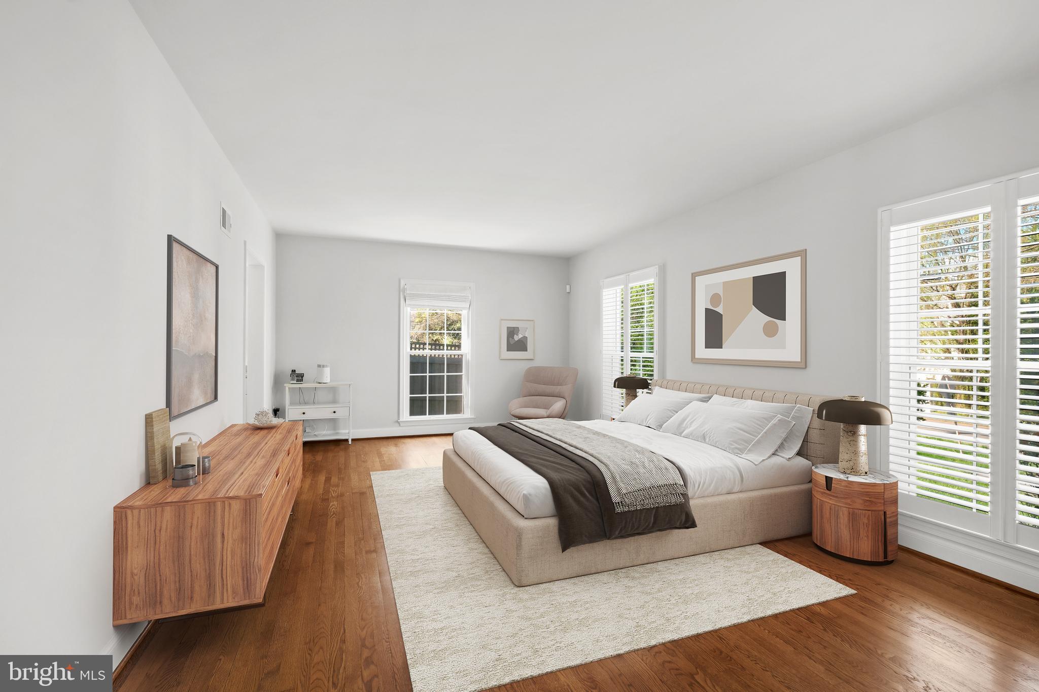 11005 Luxmanor Road North Bethesda, MD 20852 - Photo 19 of 49 a spacious bedroom with a bed and wooden floor