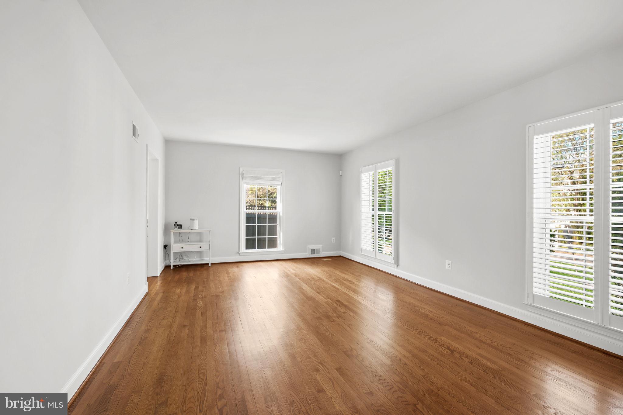 11005 Luxmanor Road North Bethesda, MD 20852 - Photo 20 of 49 an empty room with wooden floor and windows