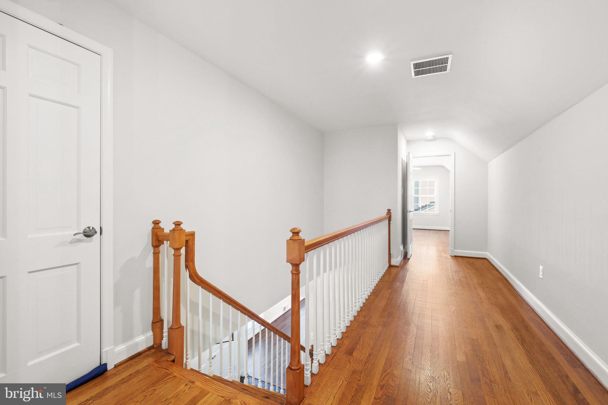 11005 Luxmanor Road North Bethesda, MD 20852 - Photo 26 of 49 a view of a hallway with wooden floor