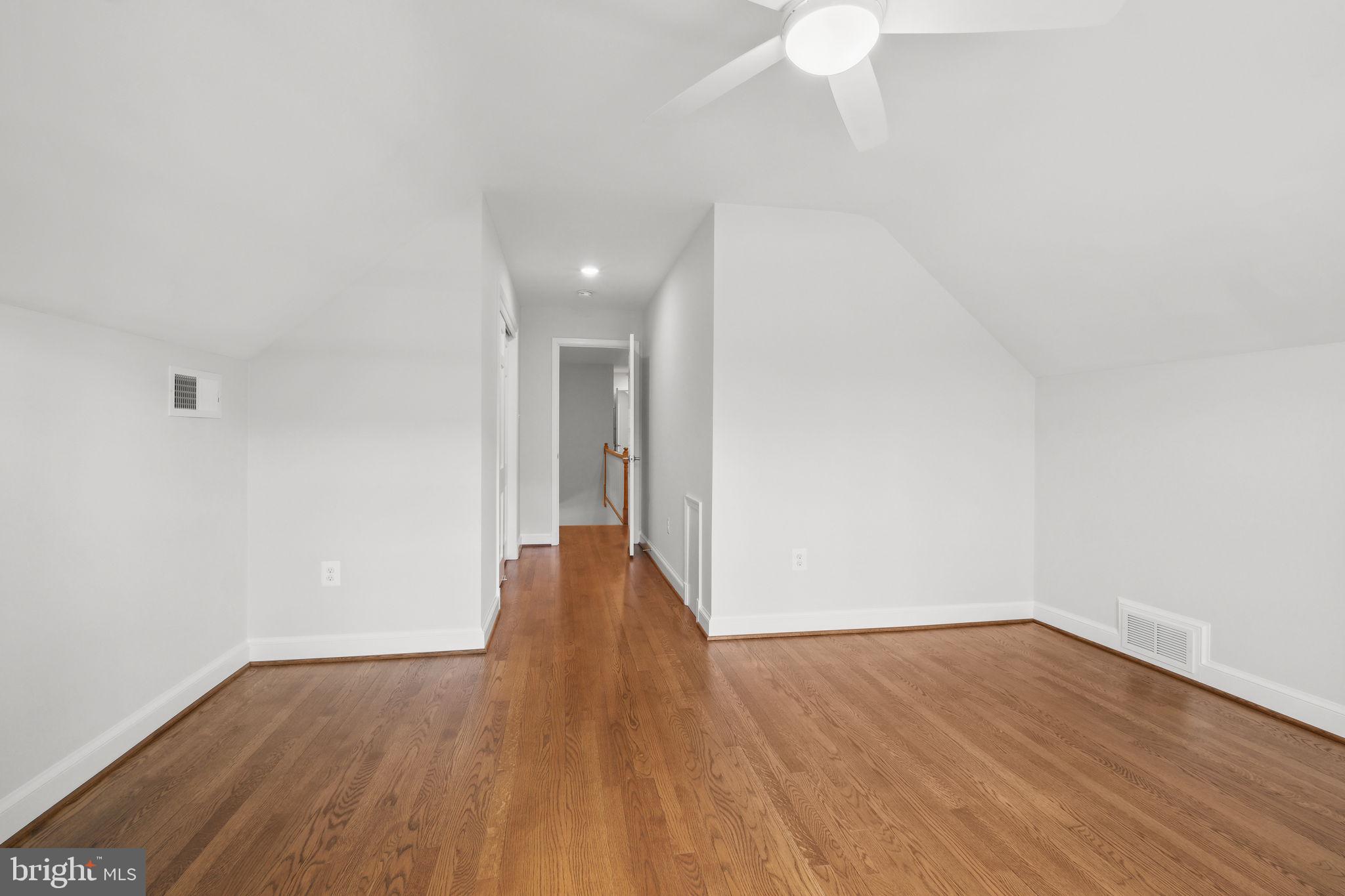 11005 Luxmanor Road North Bethesda, MD 20852 - Photo 28 of 49 a view of an empty room with wooden floor