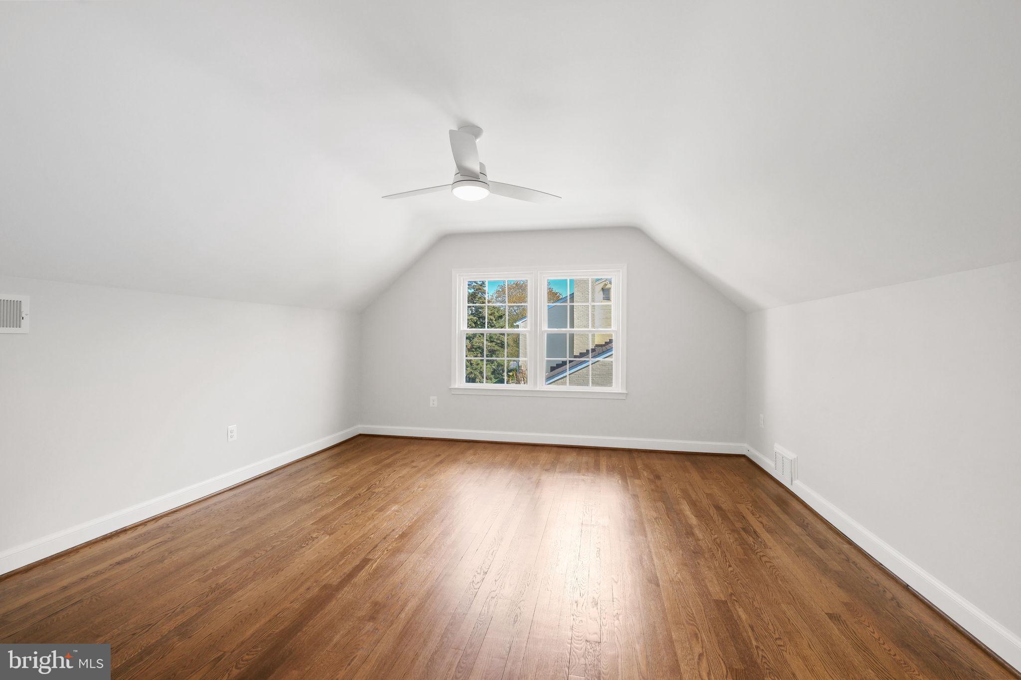 11005 Luxmanor Road North Bethesda, MD 20852 - Photo 29 of 49 an empty room with wooden floor cabinet and windows