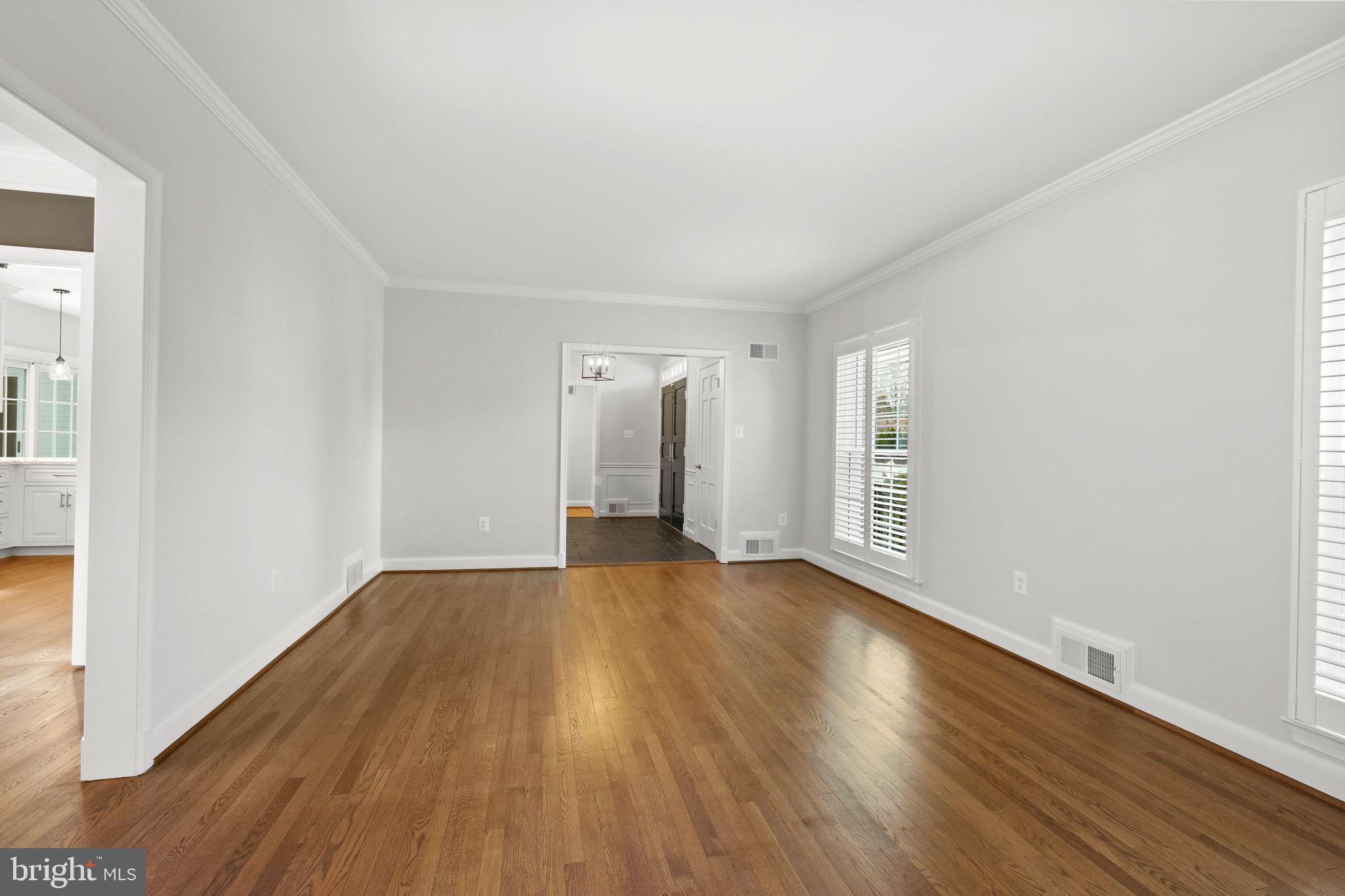 11005 Luxmanor Road North Bethesda, MD 20852 - Photo 10 of 49 a view of an empty room with wooden floor and a window