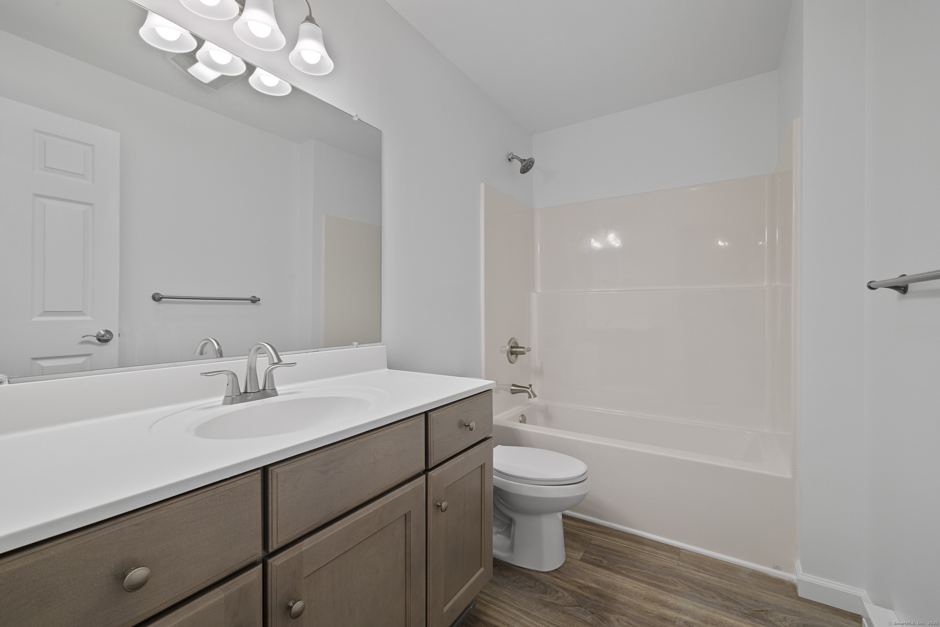 156 Grove Avenue, Unit B Groton, CT 06340 - Photo 4 of 6 a bathroom with a sink a toilet and shower