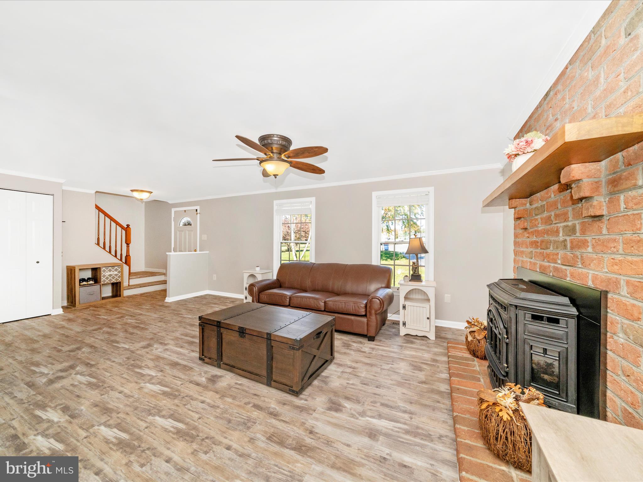2684 Lydia Court Adamstown, MD 21710 - Photo 12 of 44 a living room with furniture and a fireplace
